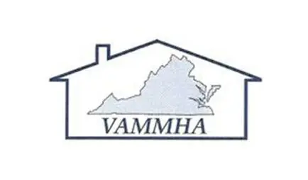 A white house with the word vammha in front of it.